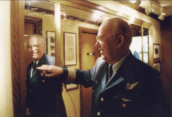A Canadian Air Force veteran points to his signature on Bettys Mirror during a visit in 2010