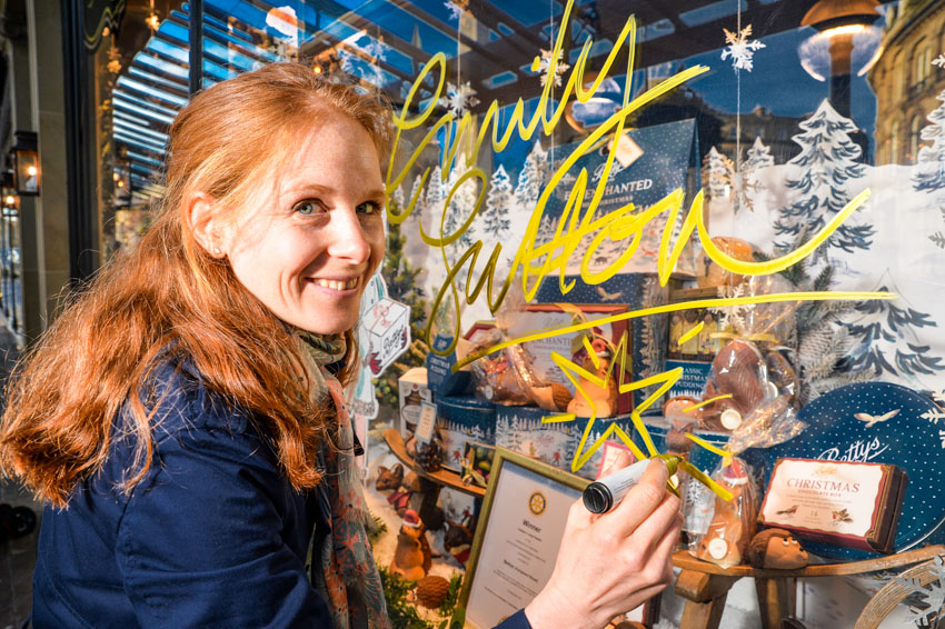 Emily Sutton signs our Harrogate window which included displays of her artwork
